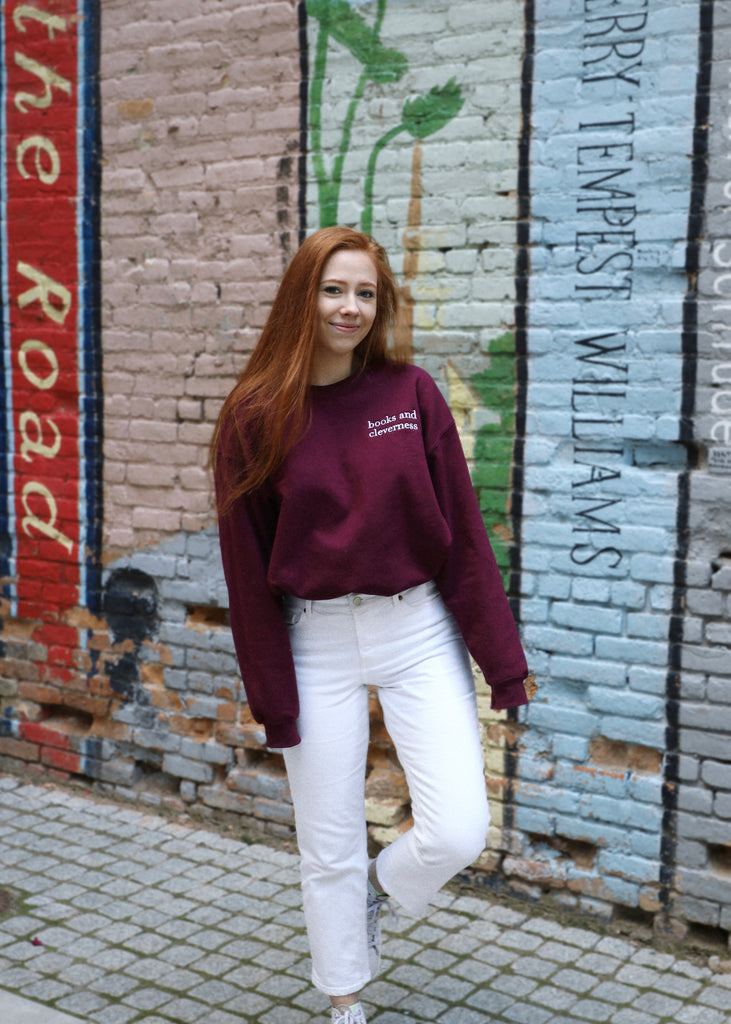 books and cleverness embroidered crewneck