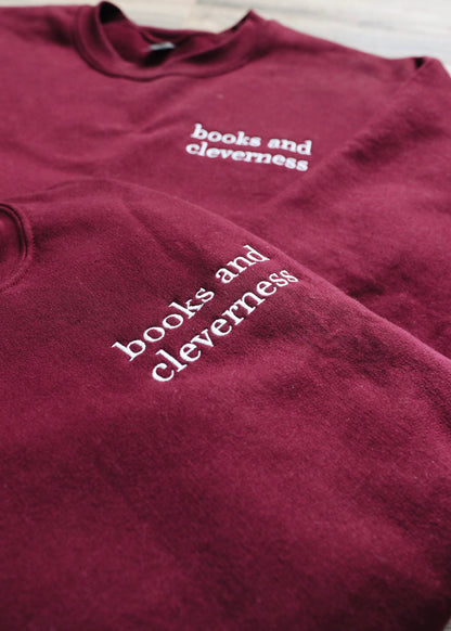 books and cleverness embroidered crewneck